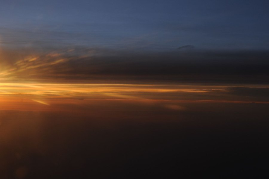 Clouds and aircraft wing from a window seat